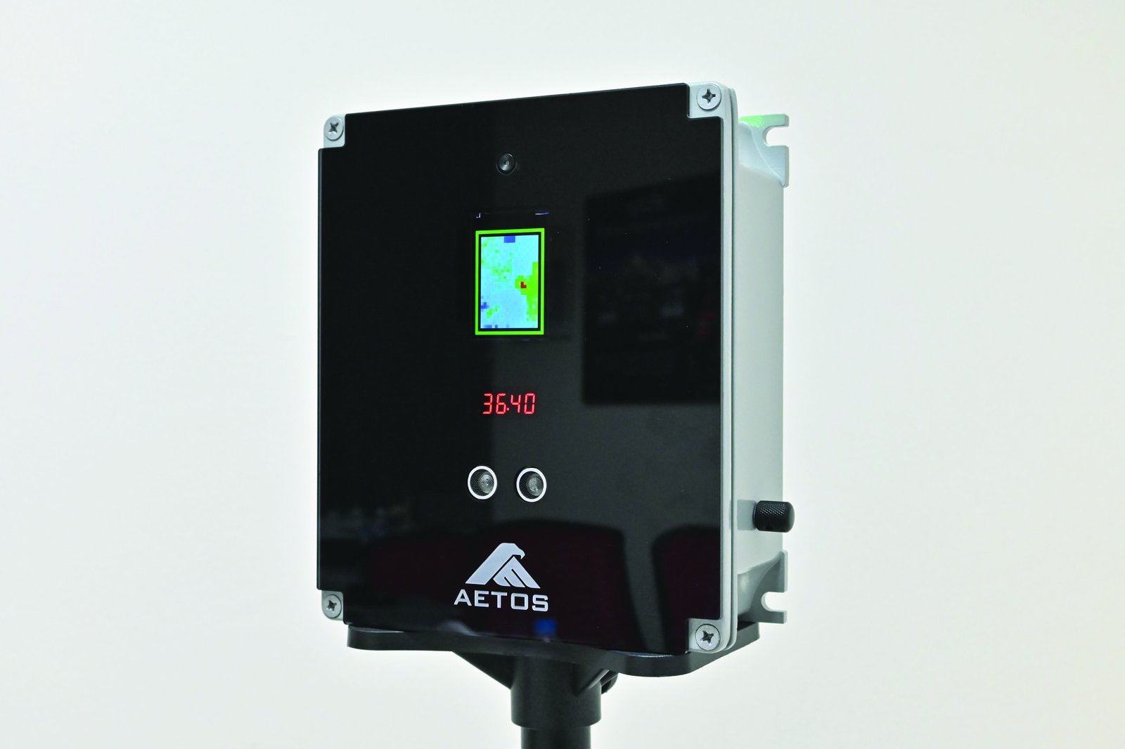 AETOS KoolScan contactless temperature scanner displaying a live reading