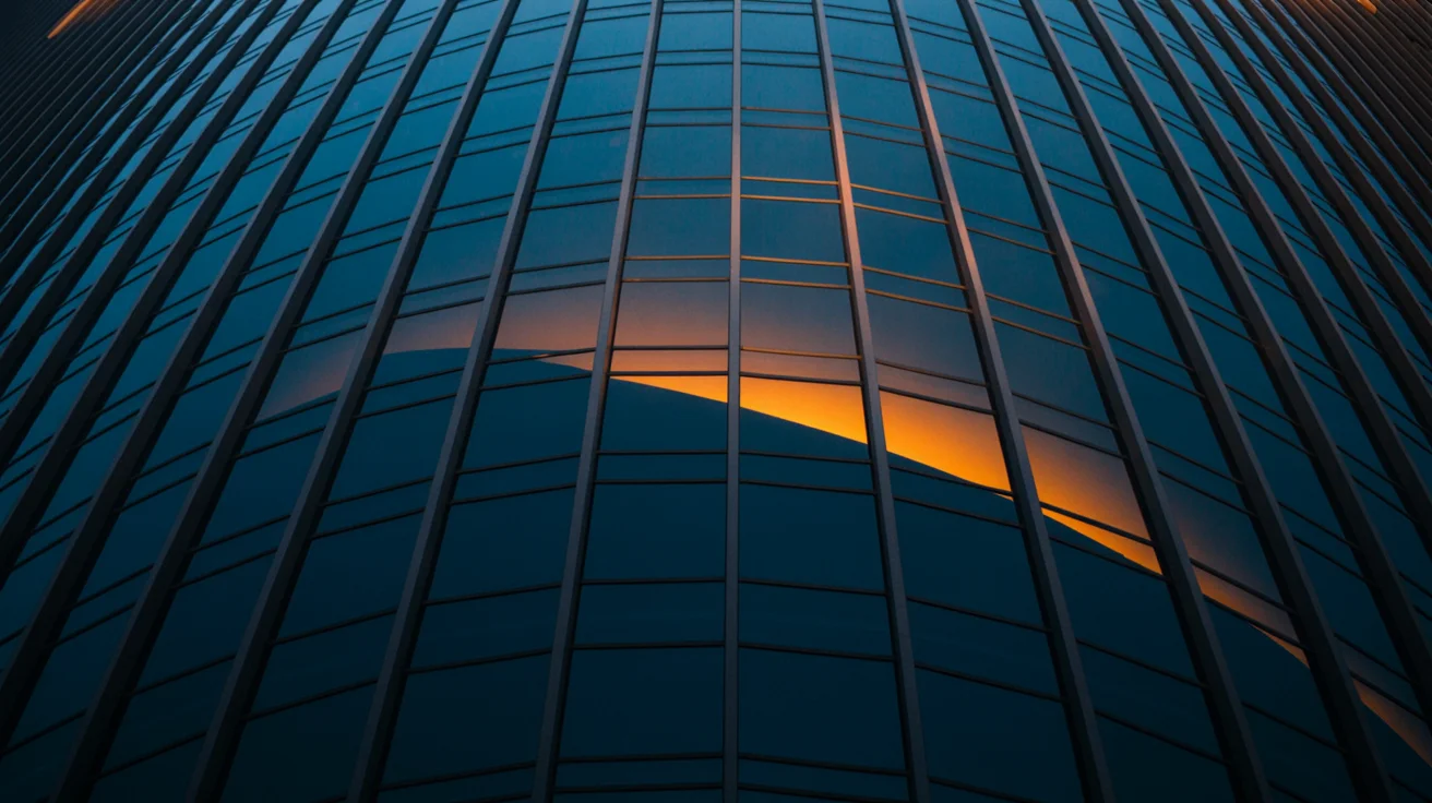 Illuminated glass grid facade with warm orange light crossing the panes, echoing the principle-by-stage grid above